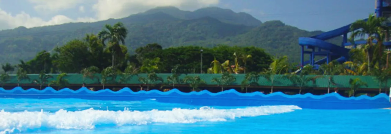 Wide swimming pool with mountain backdrop at La Vista Pansol